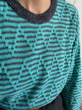 Maglione verde acqua a righe