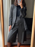 Completo grigio con pantagonna