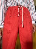 Pantaloni rosso chiaro con incrocio