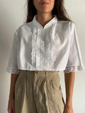 Camicia crop con bottoni dietro