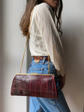 Borsetta bordeaux con catenina