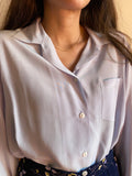Camicia azzurra di seta