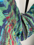 Maglione colorato base verde