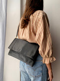 Maxi pochette nera con tracolla