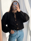 Cardigan nero intrecciato