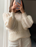 Maglione bianco con maniche a sbuffo