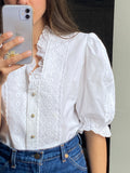 Camicia bianca con dettagli in pizzo